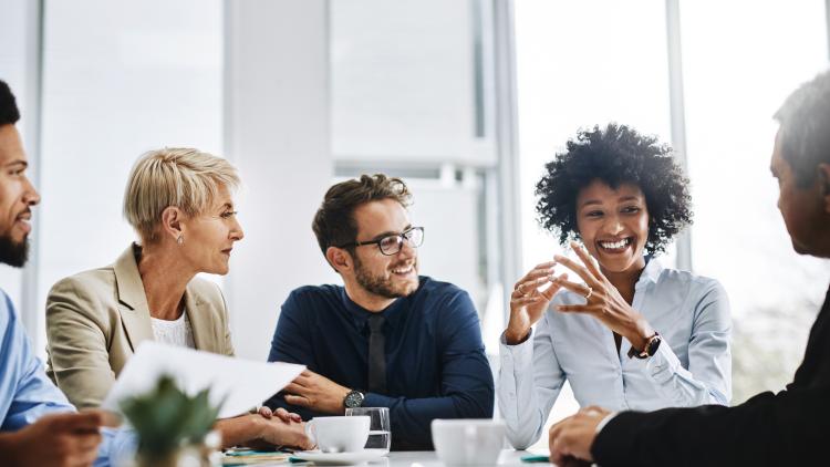 With the help of the whole team, anything is possible. Shot of a group of businesspeople sitting together in a meeting. By Delmaine Donson/peopleimages.com
